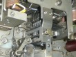thumbnail photo of a complex mechanism, the central part is held in by two bolts, one obviously loose
